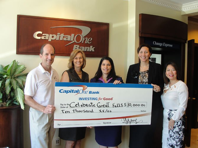 Mike Kearney and Candace Campbell of Celebrate Great Falls receive Capital One Bank’s donation from Yenisel Gamez, Great Falls branch manager, Heidi Joseph, district manager, and Trang Nguyen-Do, vice president, business banking.