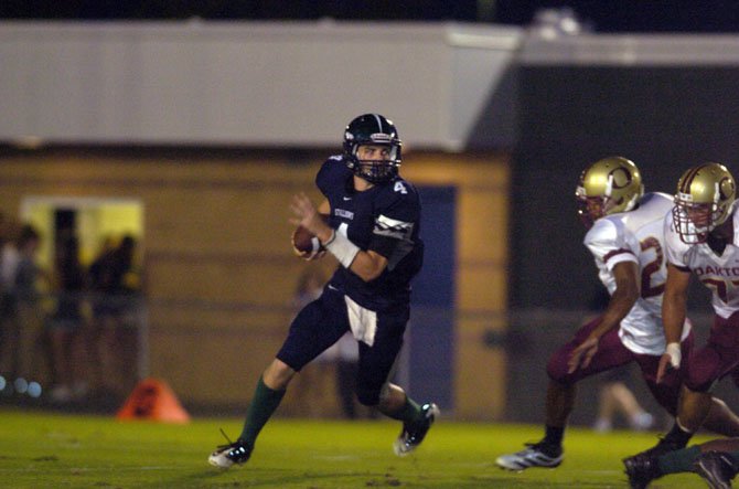 South County quarterback David Symmes scored three rushing touchdowns against Oakton on Sept. 7.