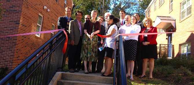 County leaders cut the ribbon at Buchanan Gardens, which will now offer affordable housing to hundreds of residents on Columbia Pike.