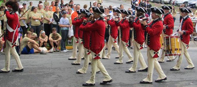 The Old Guard Fife and Drum Corps performs at last year’s McLean 5K. This year’s will raise money for transitional housing for Wounded Warriors at Vinson Hall. 