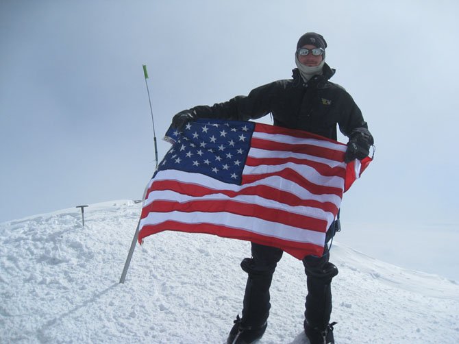 Brian DeMocker, of McLean, displaying the USA colors at the Denali summit in Alaska, July 1, 2012 at 20,320 feet.
