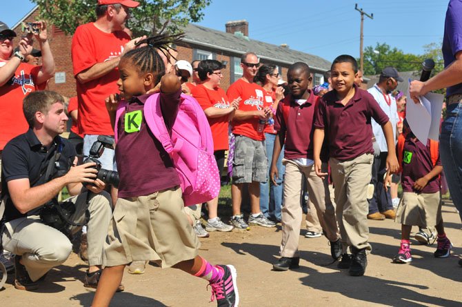 The children are cheered as they return home after a day at school.