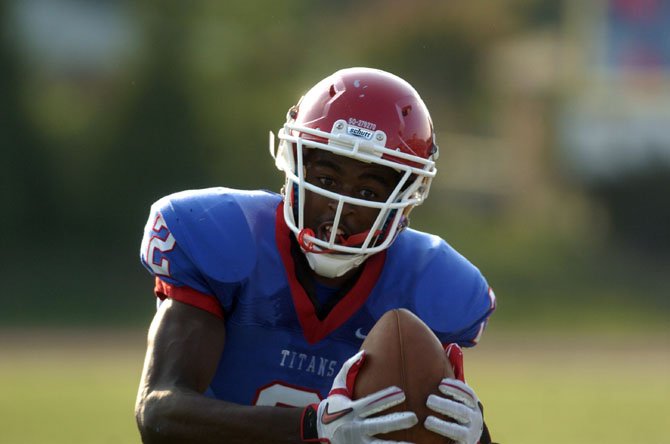 T.C. Williams receiver Landon Moss, seen earlier this season, caught three touchdown passes from Alec Grosser during the Titans’ 40-21 loss to Robinson on Sept. 14.