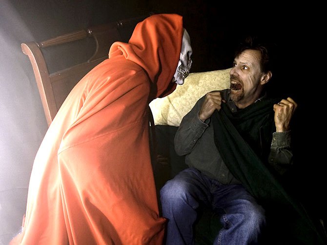 A visitor to the Bradley Farm Haunted House gets a fright. This year’s haunted house will take place Oct. 26 and 27 and will raise money for Herndon-Reston FISH.