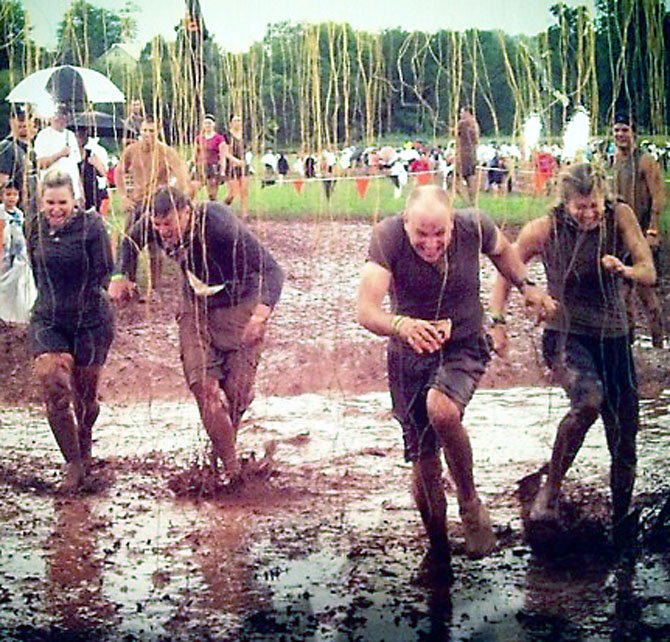 Shock Therapy: 10,000 volts of electricity rained down on “Team Grace” during the Tough Mudder race for Wounded Warriors.

