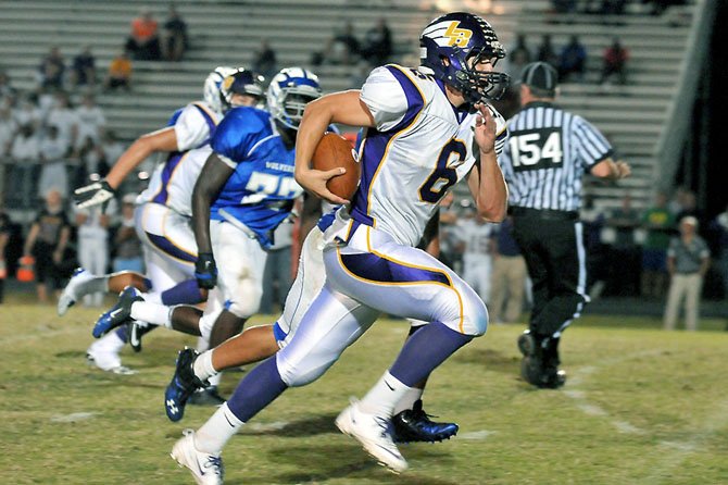 Lake Braddock quarterback Caleb Henderson on Sept. 21 led the Bruins to a win during his first game back at West Potomac High School, where he played varsity football as a sophomore.