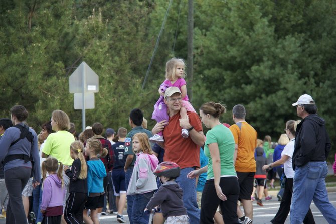 Participants in the 3K walk contributed 2,200 items of canned food and other necessities for area organizations helping people in need.