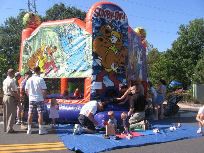 The moon bounce draws the younger Oktoberfest guests.  Children’s activities, mainly centered on the Town Green, include the moon bounce, inflatable slide, Lego tent, arts and crafts, and face-painting, and laser tag are free. The rock-climbing wall charges for the attraction.