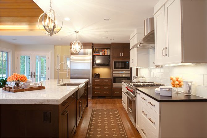 When designing this Potomac, Md. kitchen, Nadia Subaran of Aidan Design used “a mix of painted white cabinets paired with a very dark stain on cherry. I think what people like about that look is that it helps to break the kitchen up a little bit,” she said.
