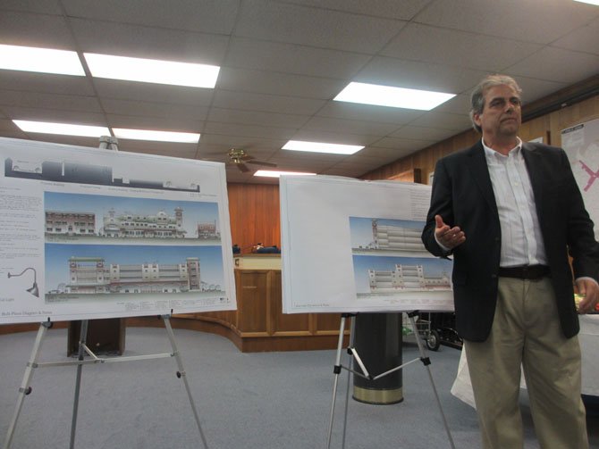 Church Street mixed-use building architect Paul Layer describes the modified elevations to the citizen audience at the public meeting on Sept. 27.