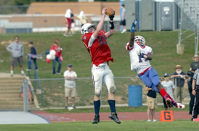 Woodson tight end Peter Murray catches a touchdown pass against T.C Williams on Oct. 6. Woodson earned its first win of the season, beating the Titans, 28-21.