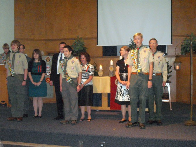 Newly Inducted Eagle Scouts (from left): Eric Lyttek, Michael Marriott and Benjamin Washechek with their parents.