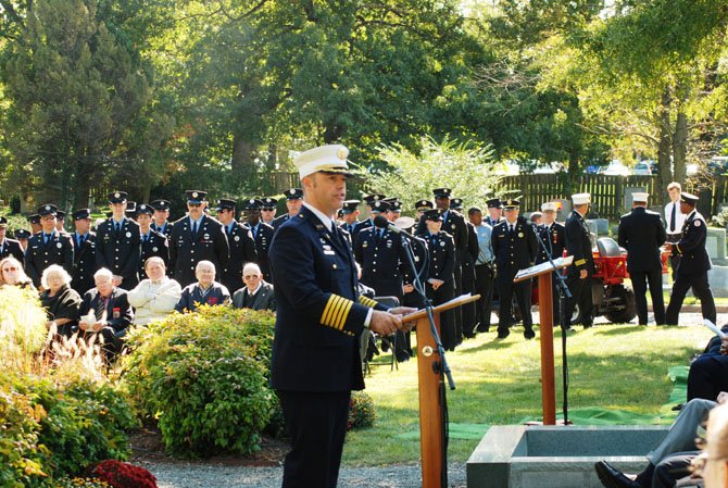 Alexandria Fire Chief Adam Thiel delivers the keynote address at the service.
