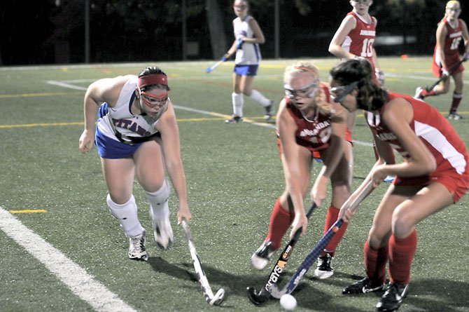 T.C. Williams senior Emma Bracken, left, had an assist during the Titans’ 2-1 win against Annandale in the opening round of the Patriot District Tournament on Oct. 15.