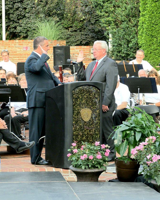 R. Scott Silverthorne becomes the City of Fairfax’s 10th mayor during his swearing-in ceremony on June 27 at the City Hall Veteran’s Amphitheater. The oath of office was administered by Clerk of the Court John Frey.