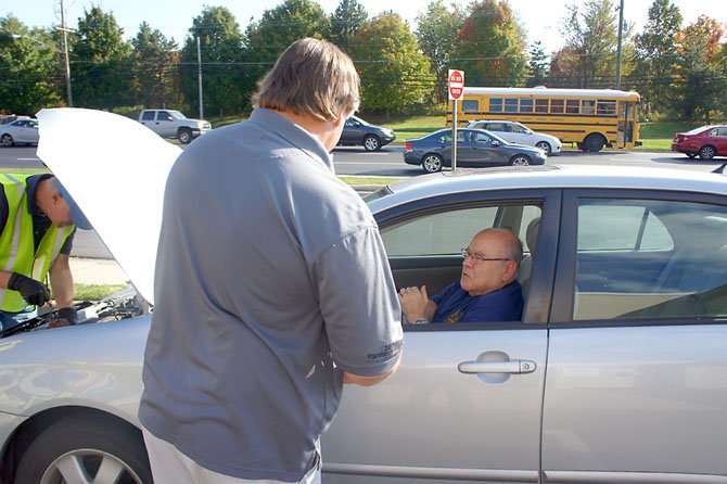 Driver Augie Arnstein of Annandale said his wife heard about the free car care check by AAA technicians, so he said "Why not come by? Anything you can do to keep the car in good shape, especially if it's free, sounds like a good idea."

