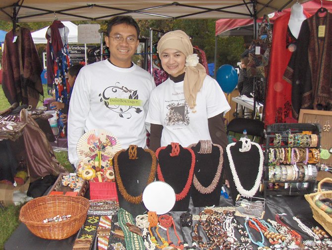 From left: Vendors Bomo and Dyan Wibowo display handmade jewelry from Indonesia during Centreville Day 2011.
