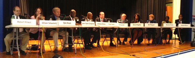 All 12 candidates gather for a debate at Lyles-Crouch Traditional Academy.