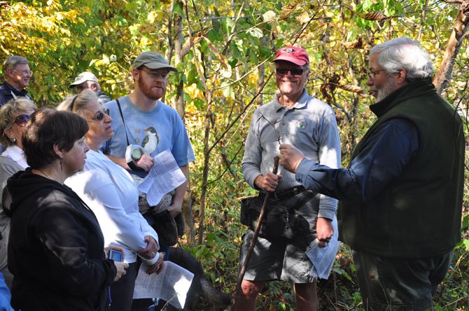 Jim McGlone of the Virginia Department of Forestry shows how large the thorns on a Honey Locust tree can get during the Riverbend Park Tree Walk Sunday, Oct. 21. 