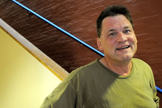 Christ House director Kevin Mondloch stands in the newly painted narthex.
