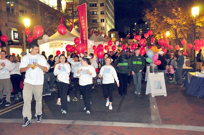 Walkers at the annual Light the Night Walk participate in the annual fundraiser for the Leukemia and Lymphoma Society Saturday, Oct. 20 at Reston Town Center.