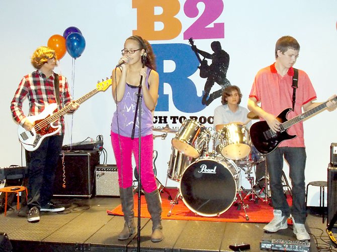 Students at the new Bach to Rock in Herndon perform as part of the grand opening Saturday, Oct. 20.