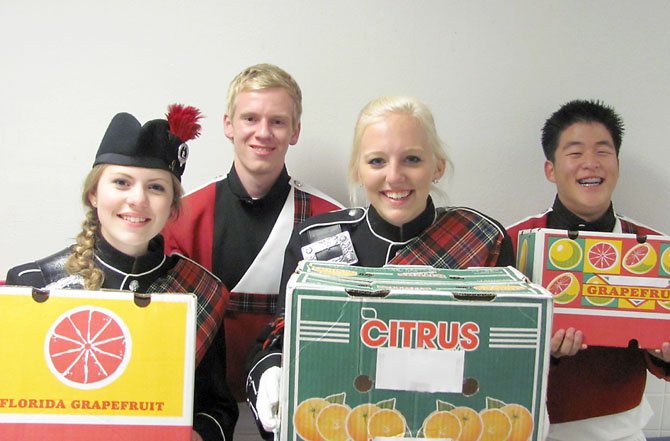 (Left to right) Highlander Drum Majors and Section Leaders Alley Arnold, Blake Robertson, Annie Lord and Nick Heo are excited to sell some fruit. The McLean High School Band's annual fruit sale runs through Nov. 15 and packages can be picked up on Saturday, Dec. 8, at McLean High School, 1633 Davidson Road, McLean. Order online at www.mcleanband.org.