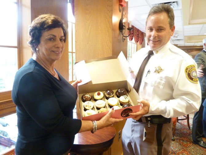 Meals on Wheels program coordinator Dolores Viehman presents Chief Deputy Tim Gleeson with cupcakes from Lavender Moon in appreciation for the volunteer services provided by the Sheriff's Department.
