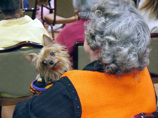 A woman with her pet at Greenspring's 10th annual Halloween Pet Parade.