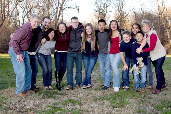 The Glass family, who live in Fairfax Station. From left: Ben, Brian and his wife Krista, Caitlin, Patrick, Kelsey, David, Leah, Matthew, Emma, Kevin and Sandi.
