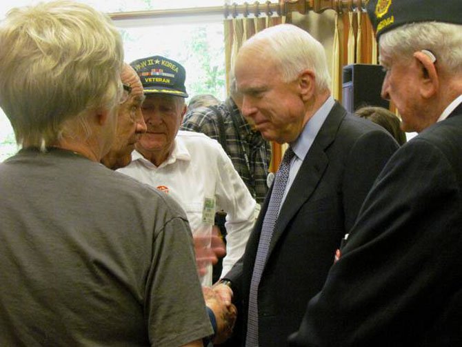 Sen. John McCain (R-Ariz.) talked with residents at Greenspring retirement community in Springfield on Friday, Oct. 26. The senior senator from Arizona was stumping for GOP presidential candidate Mitt Romney. (From left) residents Charles Fletcher, John Schultz and Tom Harrison.