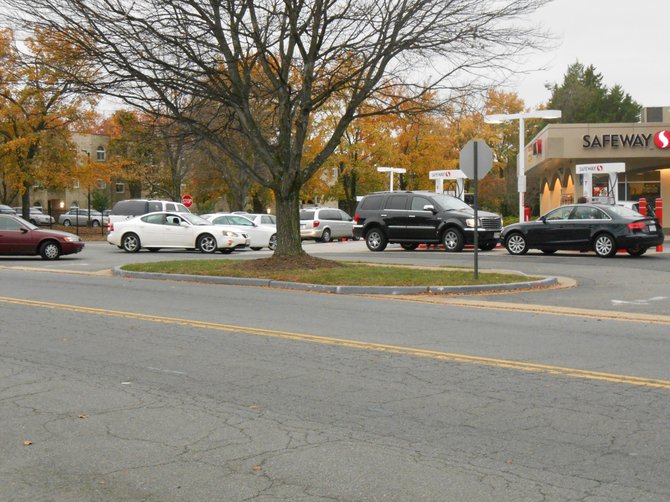 Drivers line up to fill up at the Safeway gas station on Anderson Road in McLean. Cars were five or six deep beginning Friday afternoon through Sunday. 