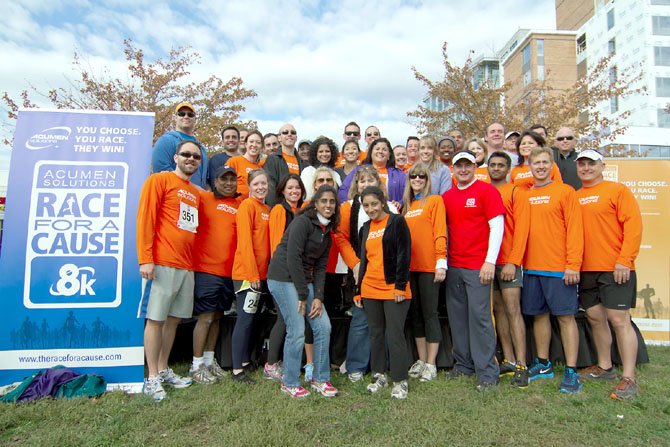 The fourth annual Acumen Solutions Race for a Cause 8K and 1-Mile Fun Run raised money for local nonprofit “superheroes.” The McLean-based Acumen team is pictured here.