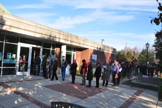 Voters line up in front of the Great Falls Library Tuesday, Nov. 6 to cast their votes.