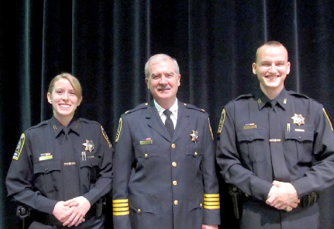 From left: Officer Katherine R. Holcombe, Col. Robert A. Carlisle and Officer John M. Digan.