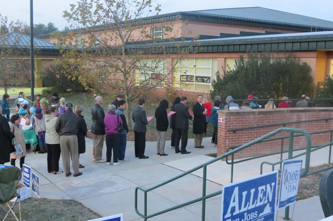 Voters stand in line at Colvin Run Elementary School at 6:30 a.m. during the morning's heaviest turnout.