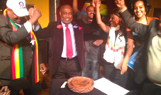 Alexandria Mayor Bill Euille celebrates victory with a traditional Ethiopian breaking-of-the-bread ceremony.