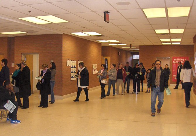 Residents in the voting line in the school hallway.

