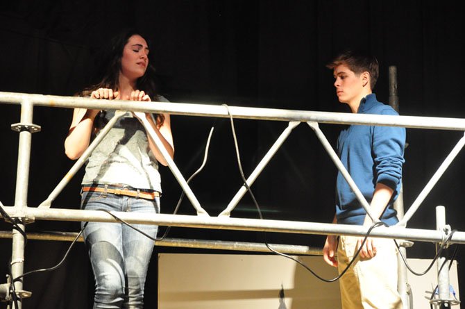 Juliet, played by Langley High School junior Kathleen Welch, tries to fend off the early affections of Romeo, played by senior Chris Paul, during the school’s production of the play.