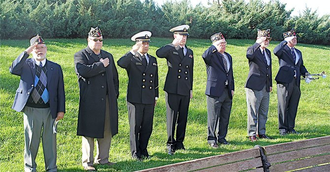 From left—David Lacombe, US Army Ret., William Spence, US Army Ret., Naval Academy sophomore Fabio Garcia, Naval Academy freshman John Wilson, William G. Wright, Sr., US Army Ret., Bob Thompson, US Navy Ret., and Eric Clauch, US Airforce. The veterans insisted that the young naval cadets join them in the military line-up. Garcia and Wilson were both members of the Herndon Junior Naval ROTC before taking the next step in their careers at the Naval Academy.
