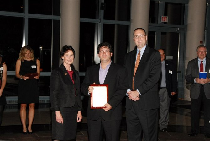 Left to right: Chairman Sharon Bulova and Lucas Cook.