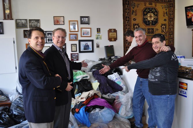 Joe Hadeed, left, and Hadeed Carpet collected more than 1,700 coats during last year's coat drive. This year's event will be held No. 17 from 8 a.m. to 5 p.m. at 3206 Duke St.
