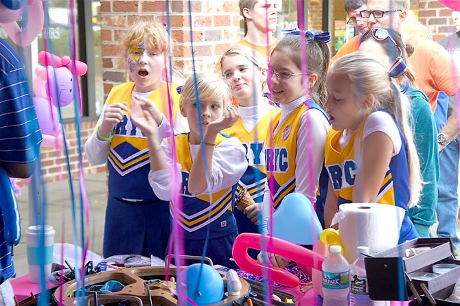 Braddock Youth Club Cheerleaders Jessica Bartoo, Aislinn Emery, Kiley Dickens, Christina Blake and Margaret Jeshow put on a pretty good show themselves, singing along to a Taylor Swift song as they waited for the balloon sculptor.