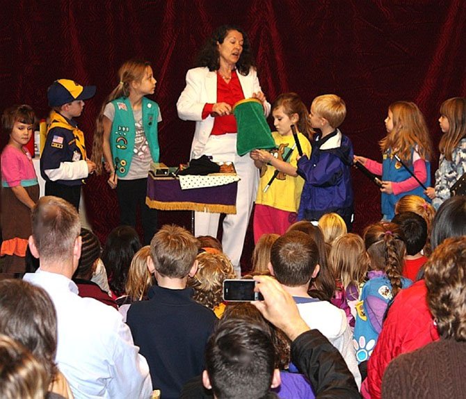 Laurie Curry had a group of children enthralled during her performance at last year's holiday magic show, featuring the International Brotherhood of Magicians Ring 50 club. 
