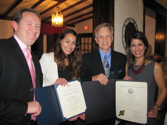 Dr. Gerald Boarman, fifth head of school at Bullis, was honored as Potomac's Business Person of the Year. Bullis is one of Potomac's largest employers, and Boarman was praised for expanding its valuable role in the community. Chamber President Adam Greenburg, Lindsay Comacho representing U.S. Rep. Chris Van Hollen, and Monika Samtani of Channel 9 join to congratulate Boarman.
