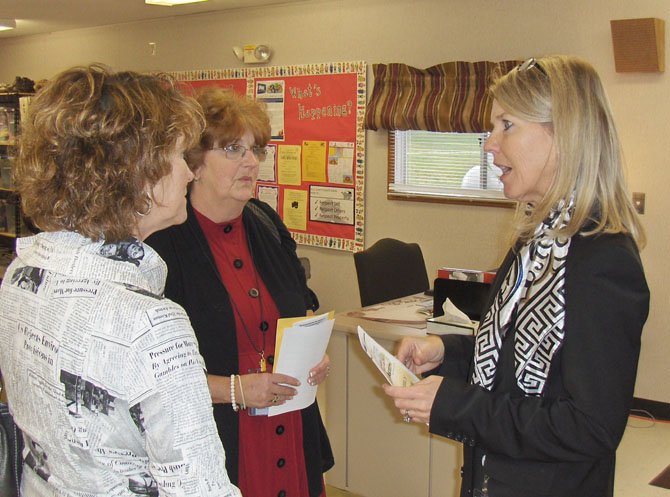 From left: Mary Shepherd, who oversees the parent centers for FCPS; Bette Morris, Cluster VII representative for Family and School Partnerships and Bull Run Principal Patti Brown chat inside the new family center.