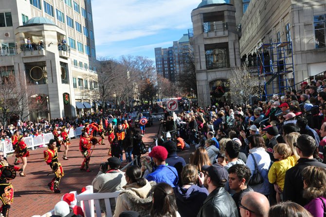 The crowd at last year's annual Reston Holiday Parade watches a Bolivian dance troupe Friday, Nov. 23, 2012 at Reston Town Center. 