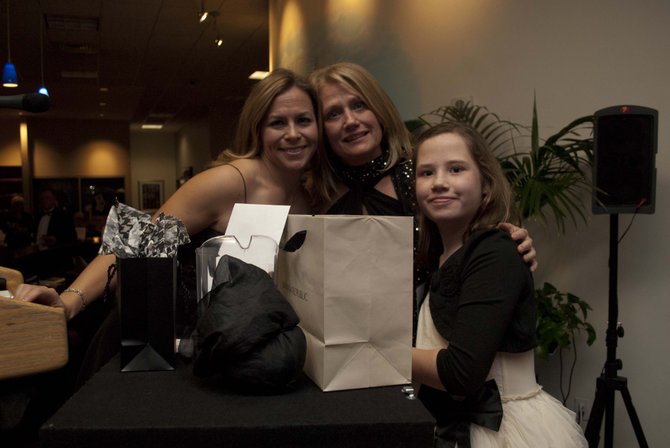 From left—Jennifer Lucier, president of the Lift Me Up! board of directors, Tracy Kenny, 2012 honoree and board member, and Keira Kenny. Great Falls resident Tracy Kenny, and volunteer Gordon Baker, were honored for their service to the organization.