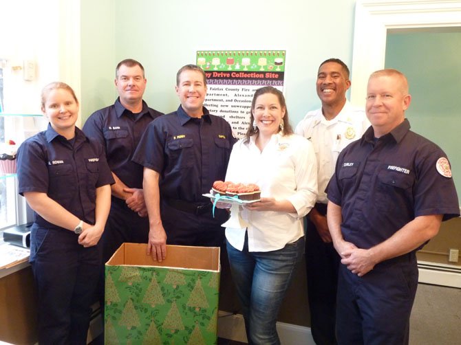 Occasionally Cake owner Sabrina Campbell is joined by firefighters Megan Rowan, Dale Barr, Phil Perry, Willie Bailey and Tim Curley Nov. 27 to kick off the 2012 Firefighters and Friends Holiday Toy Drive. The store will be collecting new, unwrapped toys for distribution by firefighters to local nonprofits and schools serving children in need.


