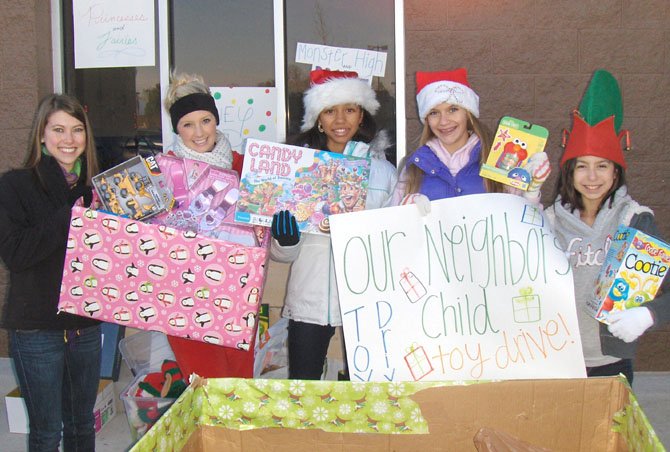 Collecting new toys for Our Neighbor’s Child, last year, outside the Fair Lakes Wal-Mart are (from left) Taylor Kim, Brooke Caskey, Brianna Crump, Katie Barta and Cristina Sturniolo. Caskey assisted ONC Executive Director Kelly Lavin, and the others were on the competition team of Creative Dance Center of Chantilly.